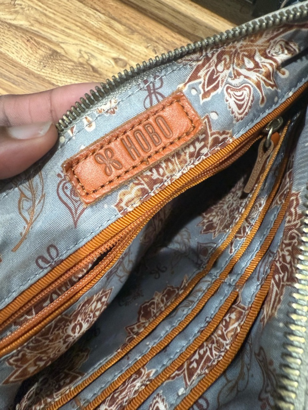 HOBO Orange-Trim Floral Interior Wristlet